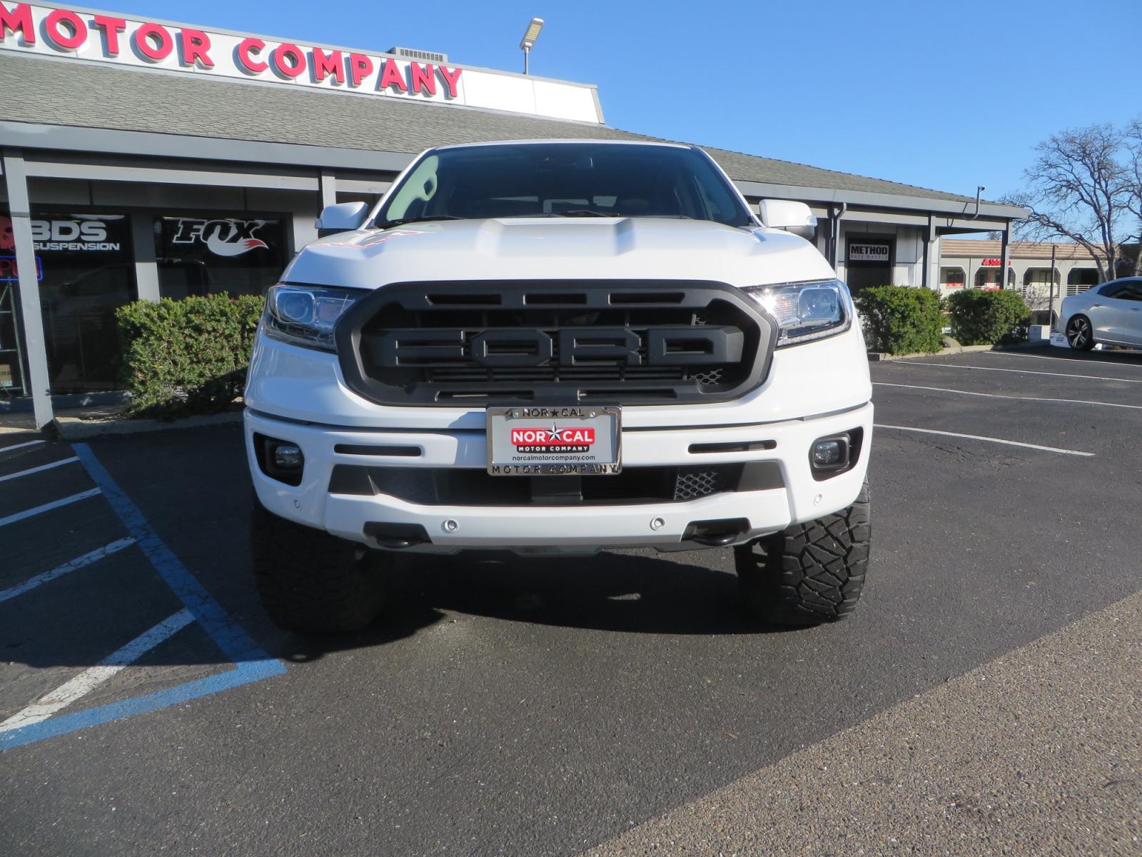 2019 White /Black Ford Ranger Lariat (1FTER4FHXKL) with an 2.3L engine, automatic transmission, located at 2630 Grass Valley Highway, Auburn, CA, 95603, (530) 508-5100, 38.937893, -121.095482 - Features a Fabtech suspension system, Fuel Offroad wheels, Nitto Ridge Grappler tires, Westin Running boards, and a Bakflip. - Photo #1